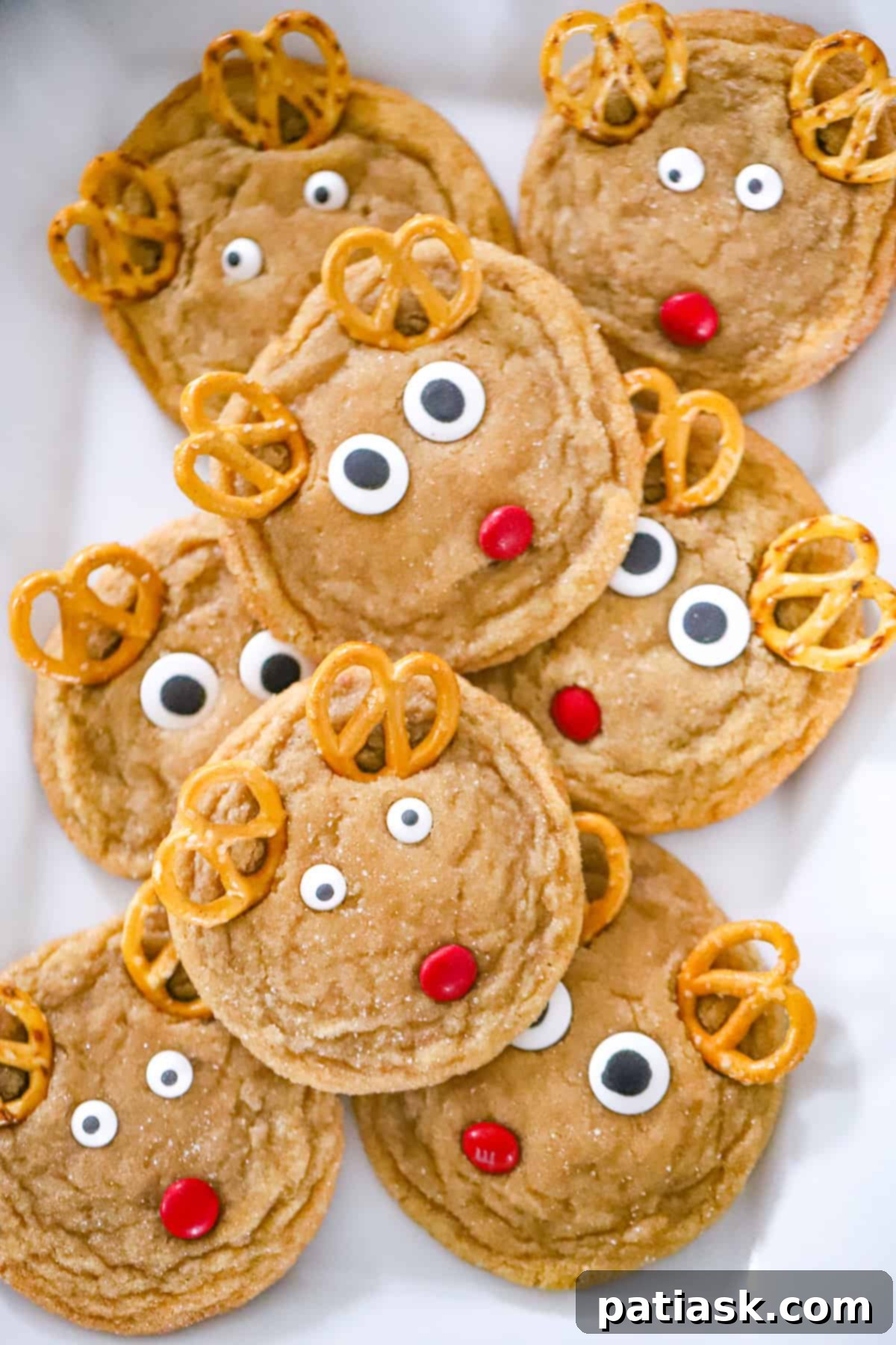 Festive Reindeer Delights 6 A festive spread of various Christmas desserts, including Reindeer Cookies.