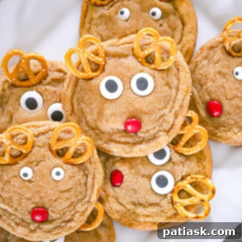 Festive Reindeer Delights 7 Beautifully decorated Christmas Reindeer Cookies with red M&M noses and pretzel antlers.