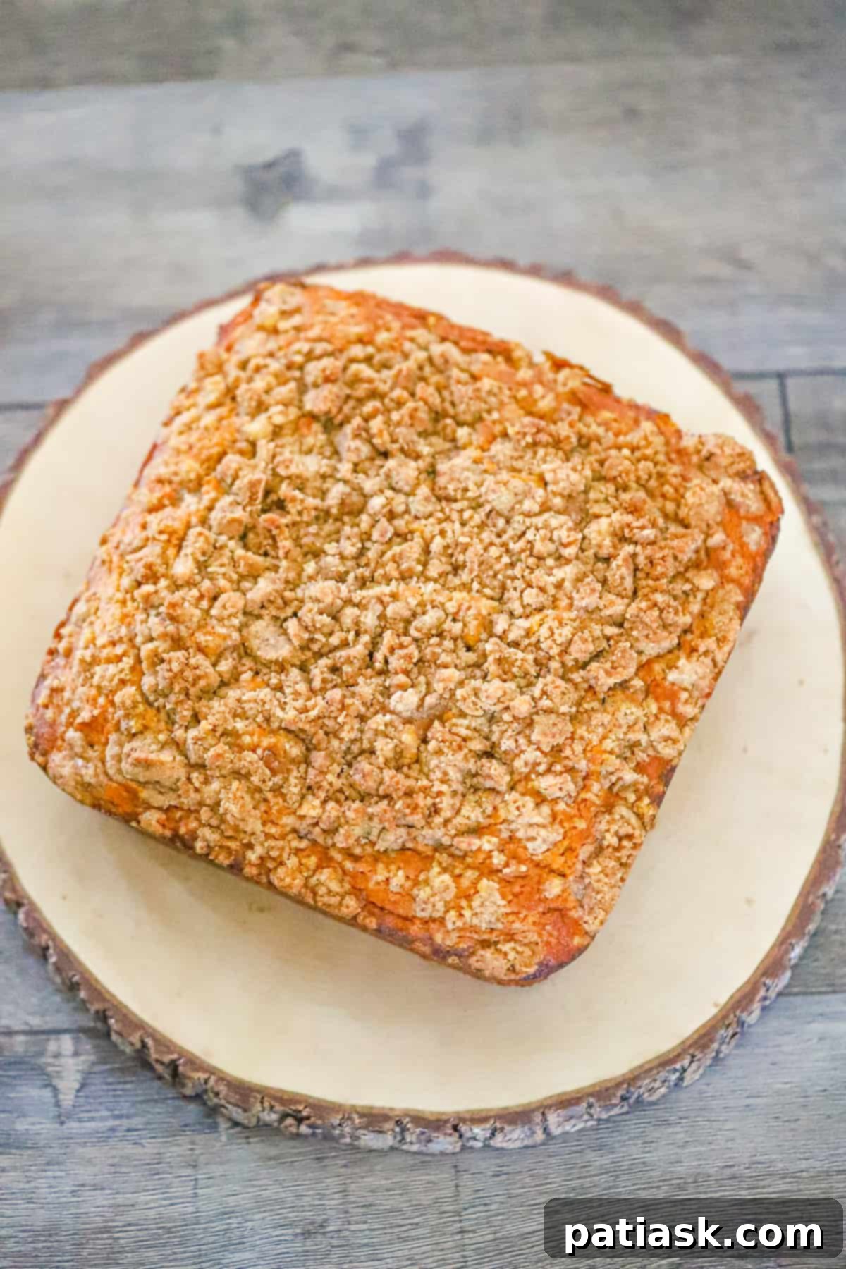 pumpkin coffee cake with a generous crumble topping, close-up shot