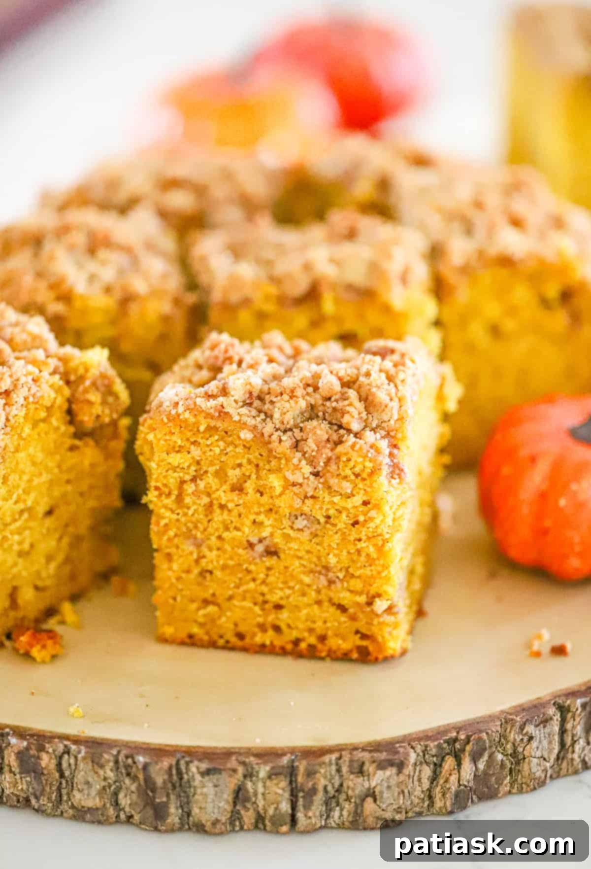 a delightful breakfast fall baking scene, showing a slice of pumpkin coffee cake