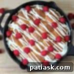 Heavenly Raspberry White Chocolate Sharing Rolls 12 Baked Skillet Raspberry-White Chocolate Pull-Apart Rolls, ready for drizzling and berries.