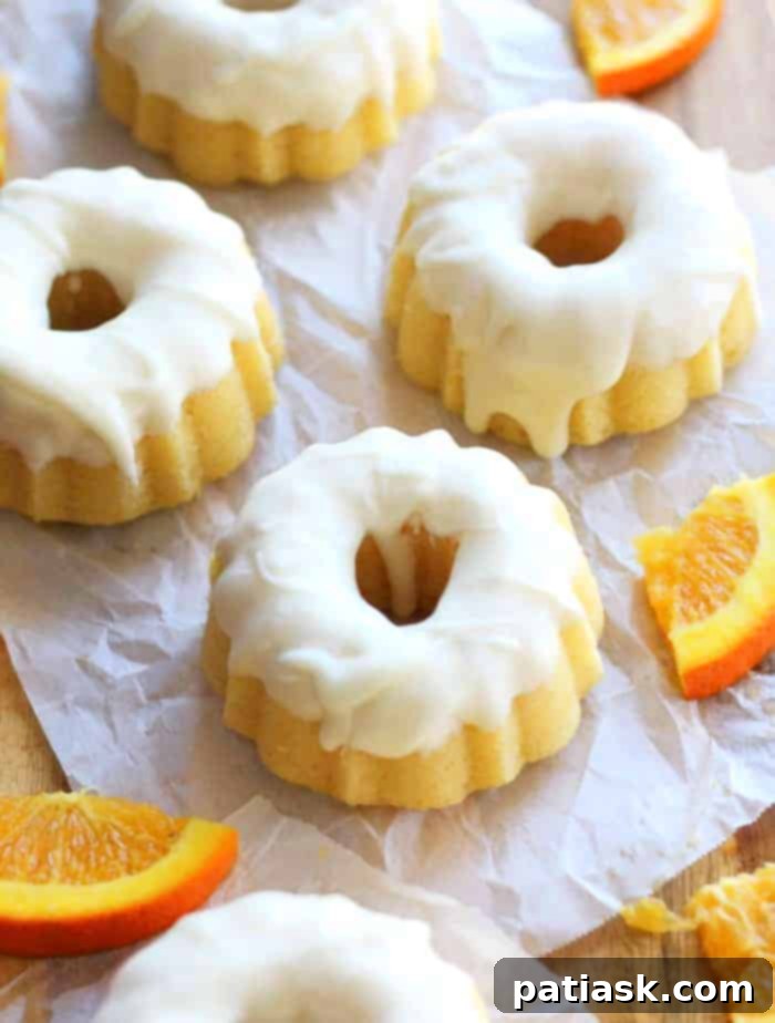 Creamy Orange Glazed Mini Bundt Pound Cakes 2 Bursting with orange flavor, mini bundt Orange Cream Glazed Pound Cakes recipe
