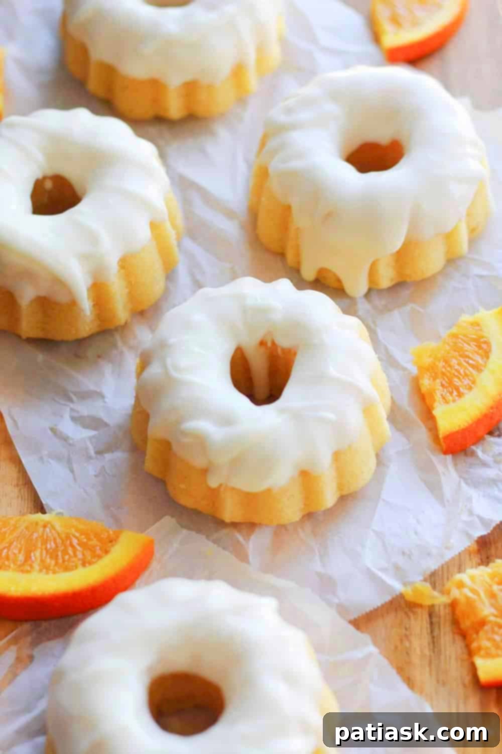 Creamy Orange Glazed Mini Bundt Pound Cakes 6 Vibrant orange pound cakes with a smooth cream glaze
