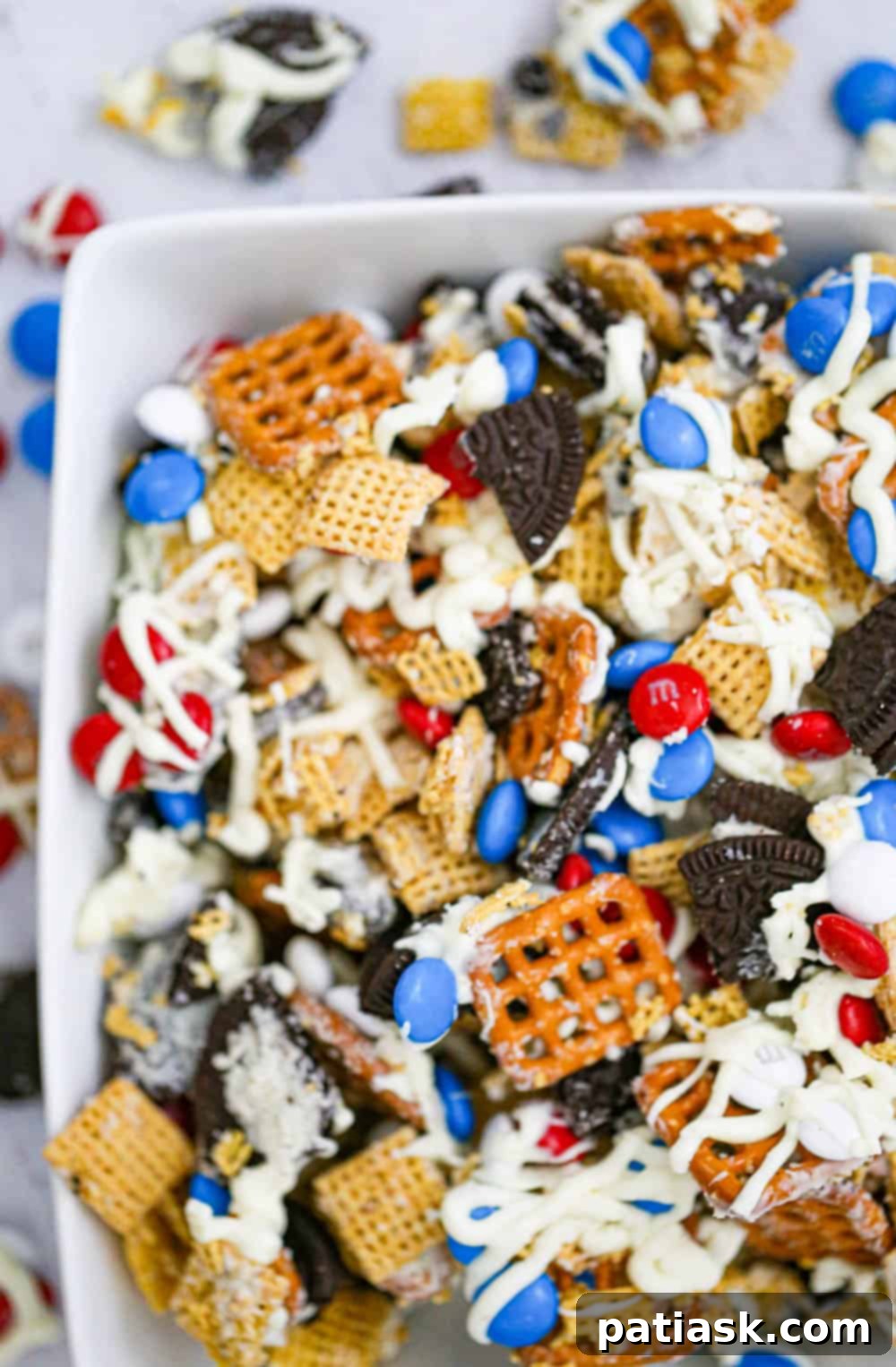 Red White and Blue Chex Crunch 3 Close-up view of the Patriotic Chex Party Mix, highlighting the rich white chocolate coating and colorful M&Ms