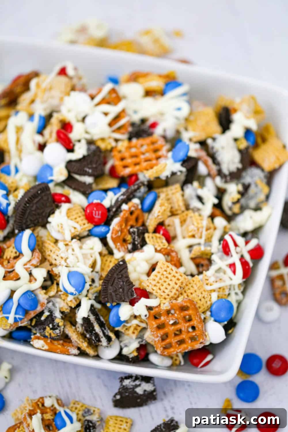 Red White and Blue Chex Crunch 4 Patriotic Chex Party Mix presented in a bowl, with a focus on its appealing textures and colors