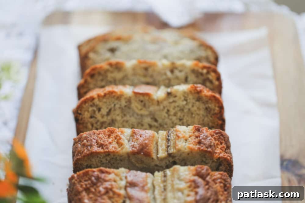 Sour Cream Banana Bread recipe sliced up on a board
