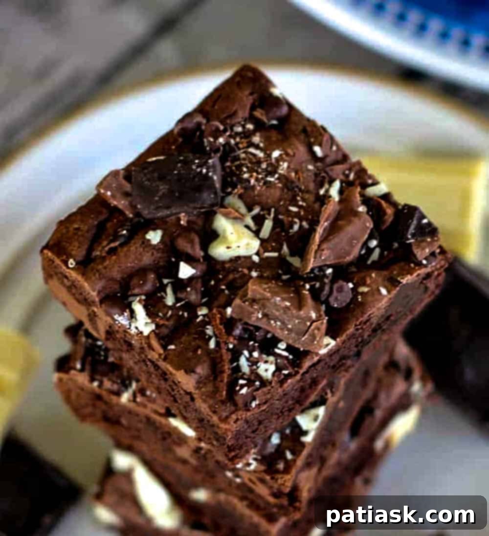 Death By Chocolate Bars neatly cut into squares, showing their thick, fudgy texture