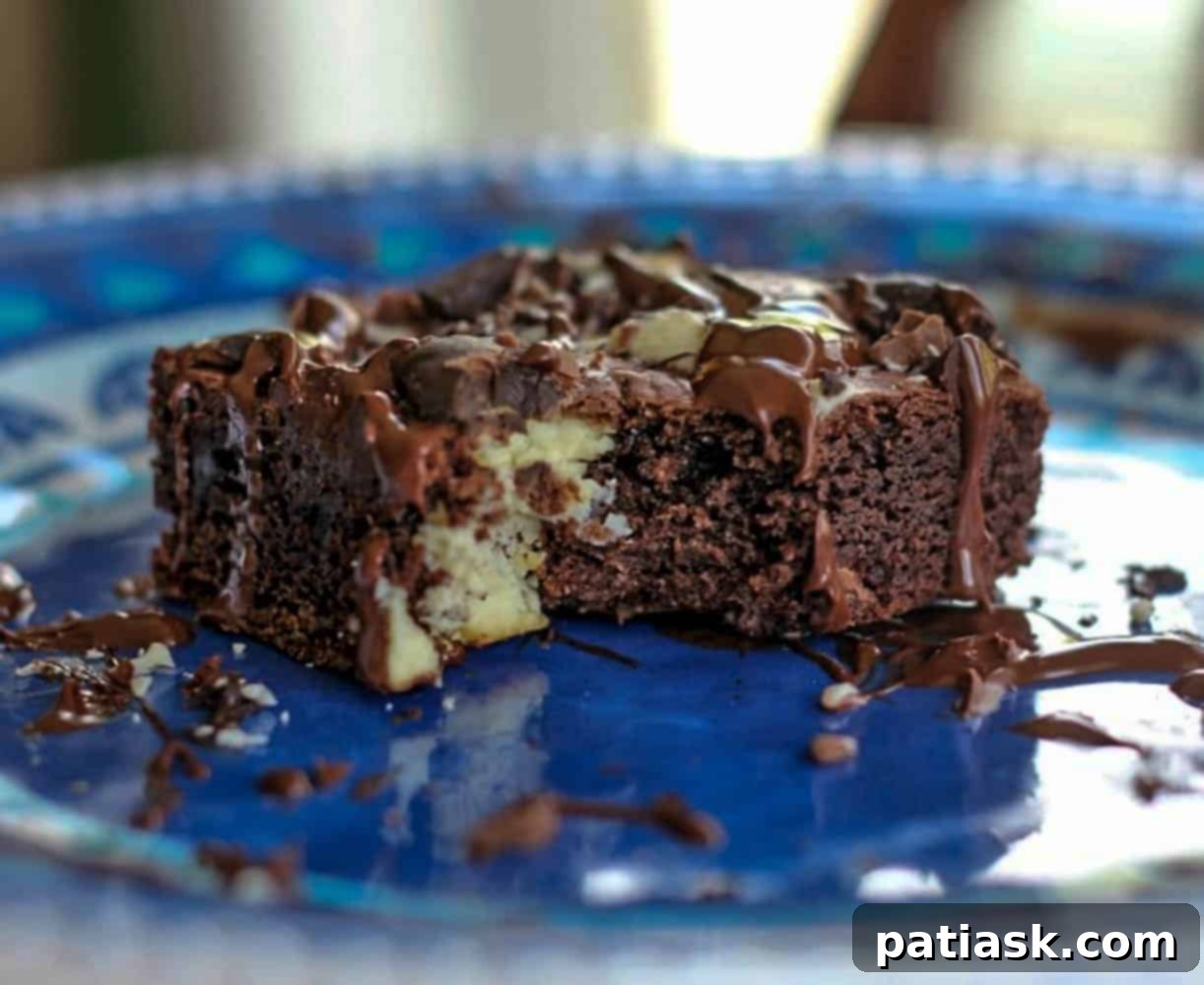 Overhead view of various Death By Chocolate Bars on a cooling rack, some with chocolate drizzle