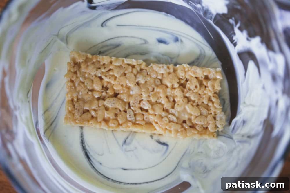 Tombstone Butterfinger Peanut Butter Skull Delights 6 White chocolate-dipped Butterfinger Skull Tombstone Treats cooling on a wire rack