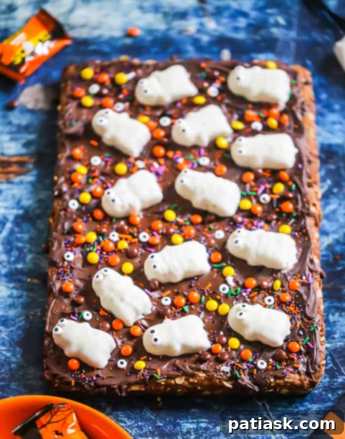 Spooktacular Reeses Monster Cookie Bars 6 Ingredients for Flourless Halloween Reese's Monster Cookie Bars, including peanut butter, oats, chocolate chips, and Reese's candy.