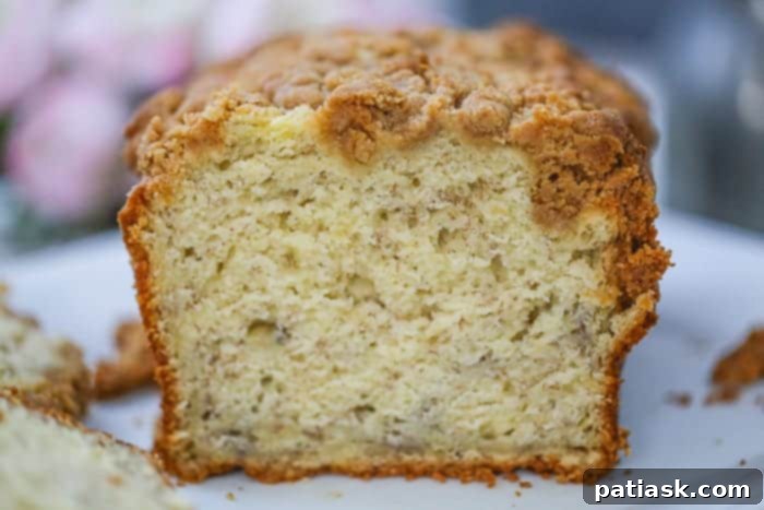 Perfectly baked Banana Cream Cheese Bread with Peanut Butter Streusel cooling on a wire rack.