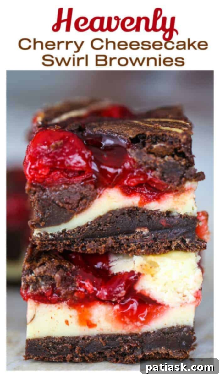 Heavenly dessert, a close-up of Cherry Cheesecake Swirl Brownies, ready to be devoured.