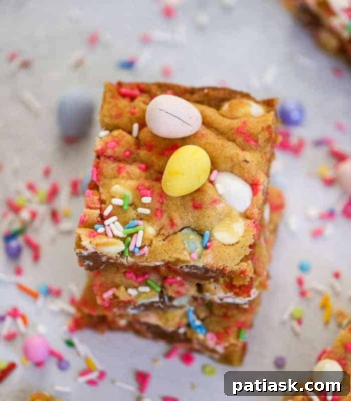 A large tray of freshly baked Cadbury Egg Cookie Bars, sliced into perfect squares, ready to be served at an Easter gathering or party