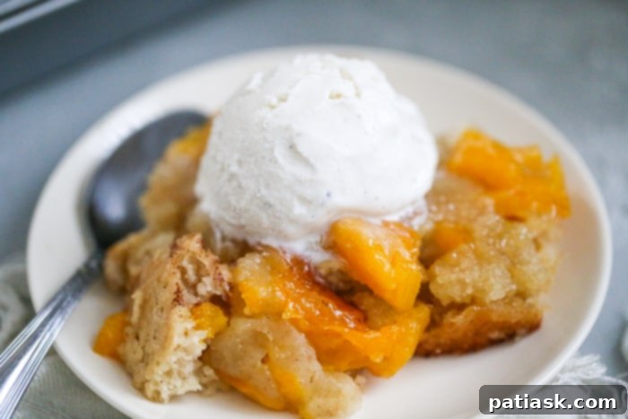 Easy Peach Cake Cobbler, batter and peaches in a dish