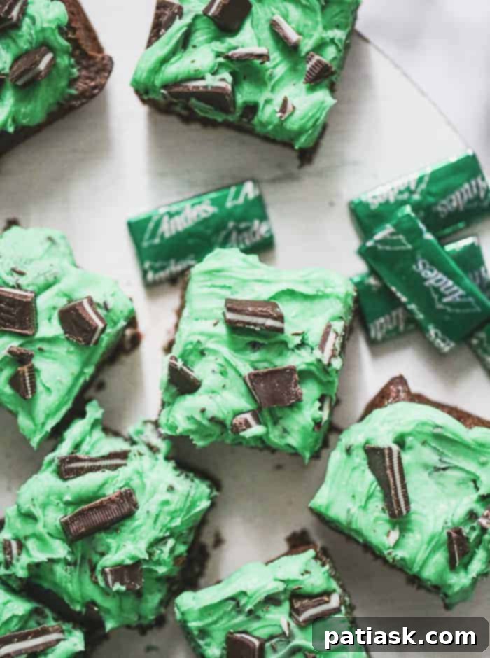 Cool Mint Triple Chocolate Fudge Brownies 8 Delicious Triple Chocolate Mint Brownies on a plate