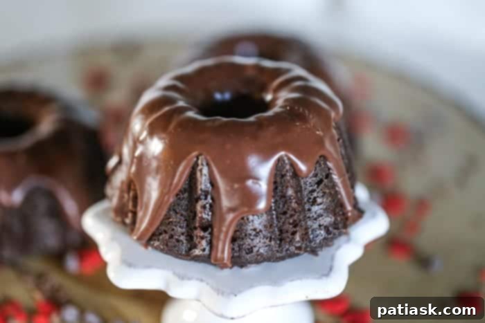 Mini Decadent Chocolate Ganache Bundt Cakes on a tiered stand