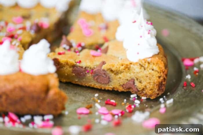 Irresistible Chocolate Chip Celebration Cookie Cake 3 Closeup of chocolate chip cookie cake with smooth frosting