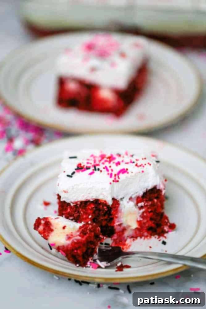 Captivating Red Velvet Cream Cheese Poke Cake, ready for serving.