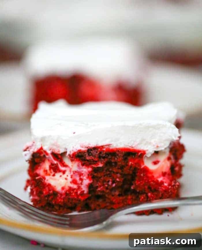Delightful Red Velvet Cream Cheese Poke Cake dessert recipe with pudding and cheesecake elements.