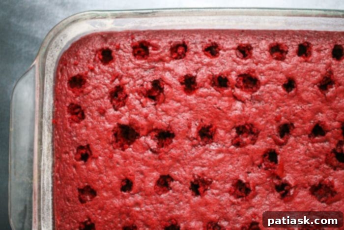 Close-up of a dessert recipe with poked holes, ready for filling.