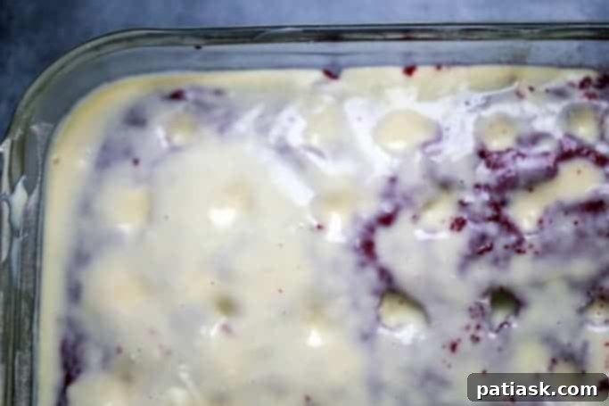 Detailed shot of a dessert recipe being filled with sweetened condensed milk mixture.