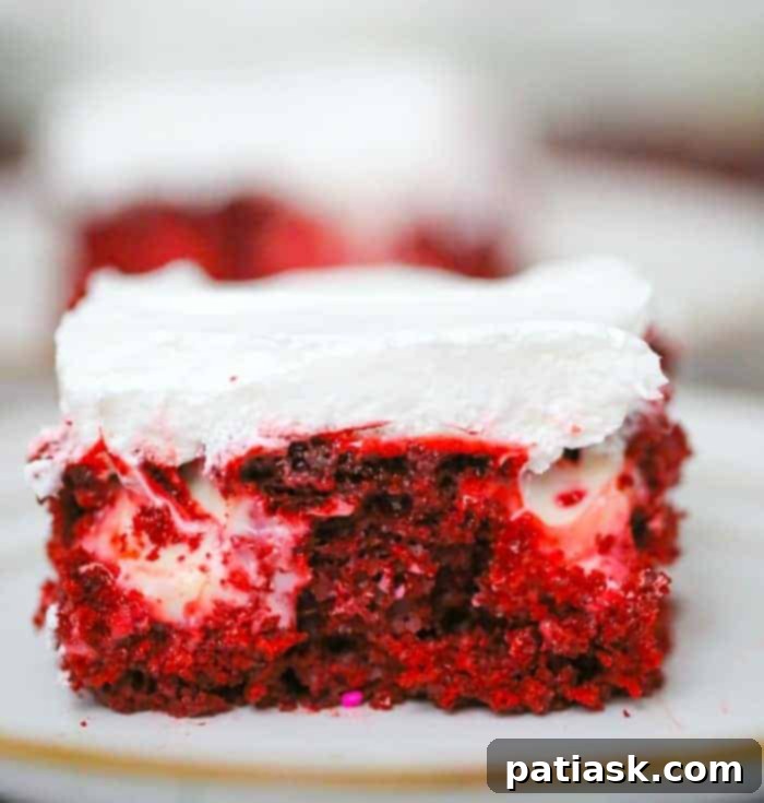 Beautiful Red Velvet Cream Cheese Poke Cake dessert recipe, featuring pudding and cheesecake layers.