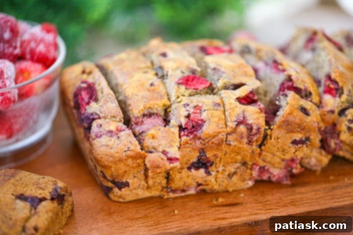 Strawberry Swirl Banana Walnut Loaf 3 Another view of the delicious Banana Strawberry Walnut Bread, showcasing its golden-brown crust and inviting texture