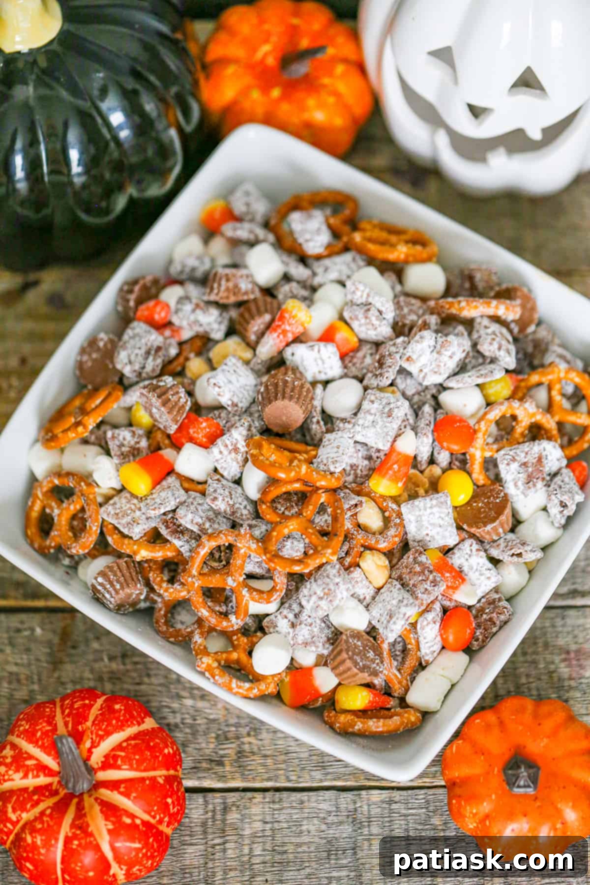 Monster Mash Puppy Chow 4 Halloween Party Puppy Chow mix recipe - a bowl filled with the colorful and crunchy snack mix, ready for serving.