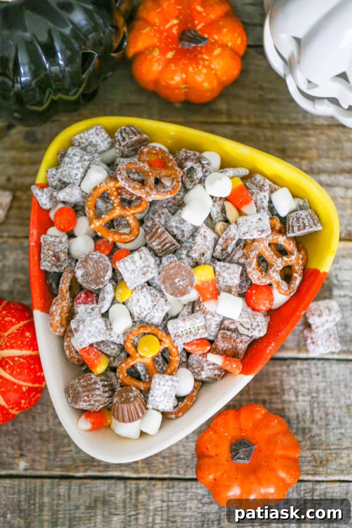 Monster Mash Puppy Chow 7 Halloween Party Puppy Chow with an assortment of candies and pretzels.