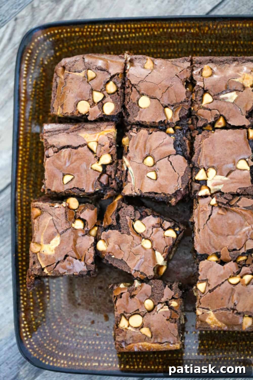 Rich and Gooey Buckeye Brownie Bars 3 Close-up of a stack of gooey buckeye brownie bars, showcasing the peanut butter layer