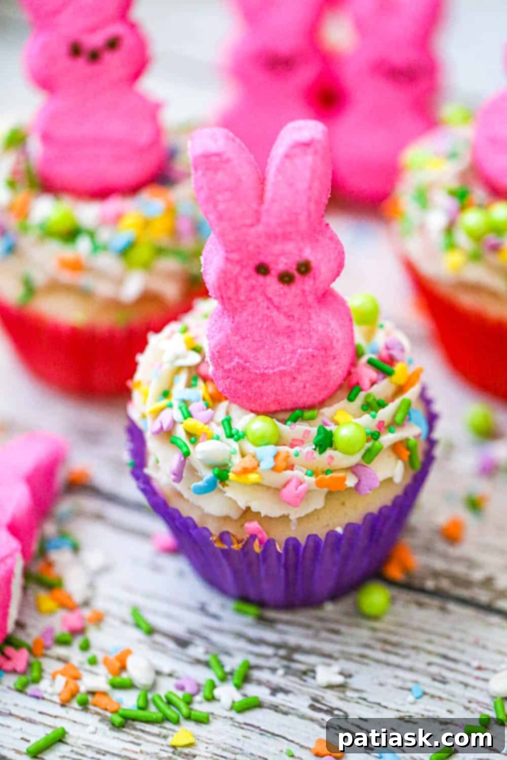 Assortment of Easter Bunny Peep cupcakes on a stand, ready for serving