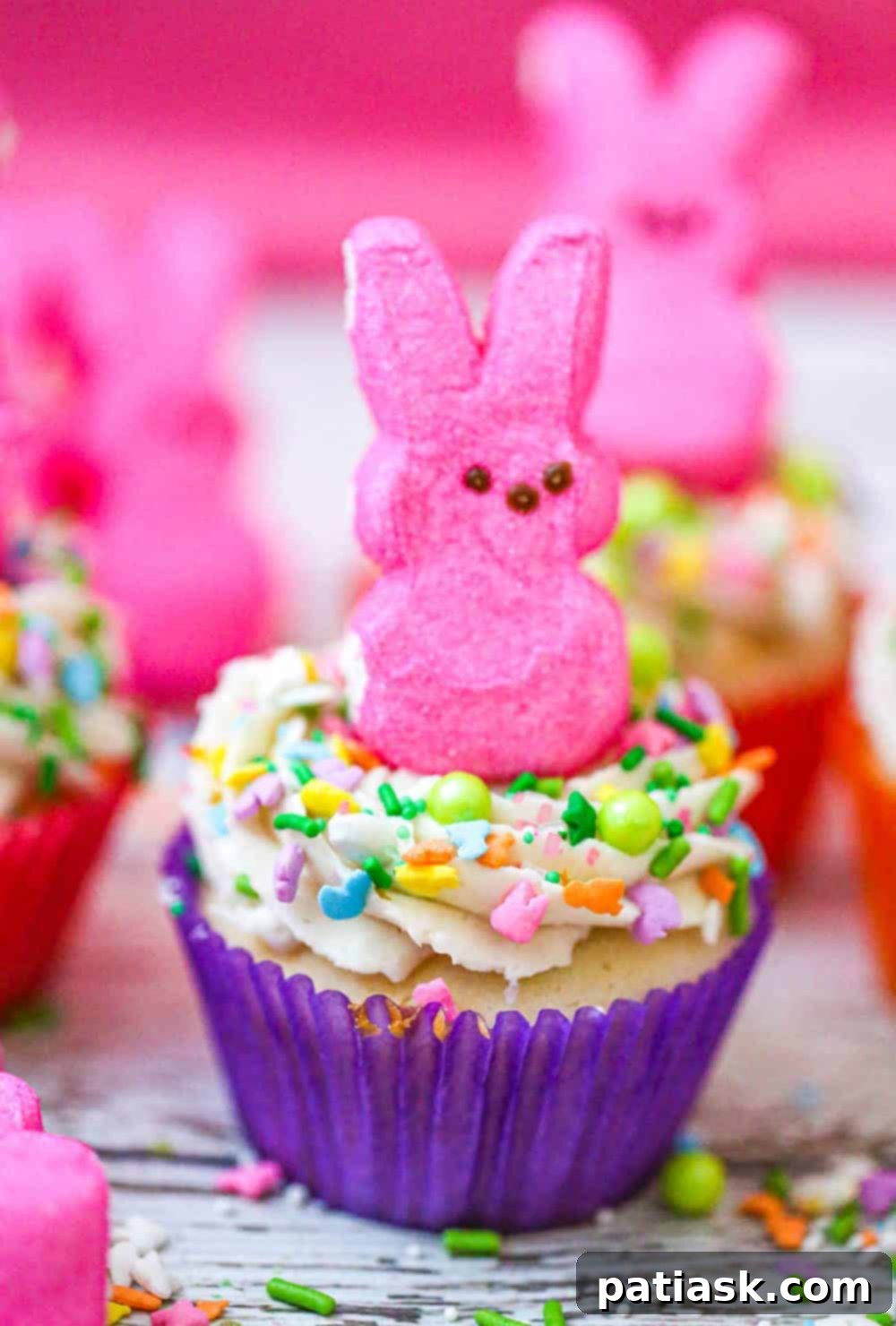 Springtime Peep Bunny Cupcakes 5 Top-down view of a single Easter Bunny Peep cupcake with white frosting and colorful sprinkles