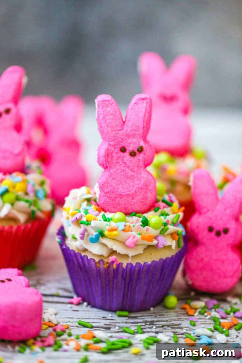 Springtime Peep Bunny Cupcakes 6 Close-up of a decorated Easter Bunny Peep cupcake with green frosting and small candy eggs