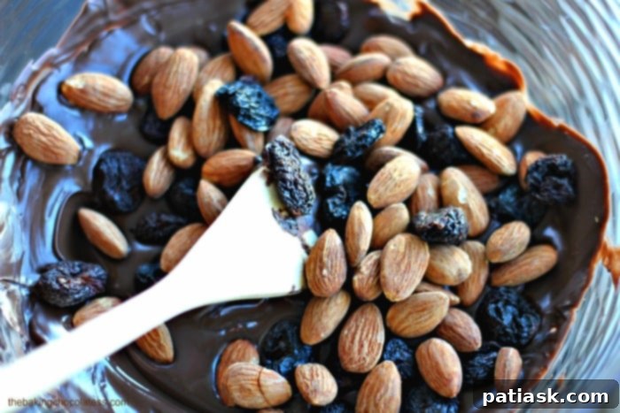 Decadent Dark Chocolate Almond Cherry Bites 3 Close-up of Dark Chocolate Covered Almond Cherry Clusters with Sea Salt