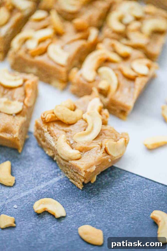 Velvety Cashew Peanut Butter Fudge 3 Perfectly sliced pieces of Cashew Peanut Butter Fudge on a serving plate