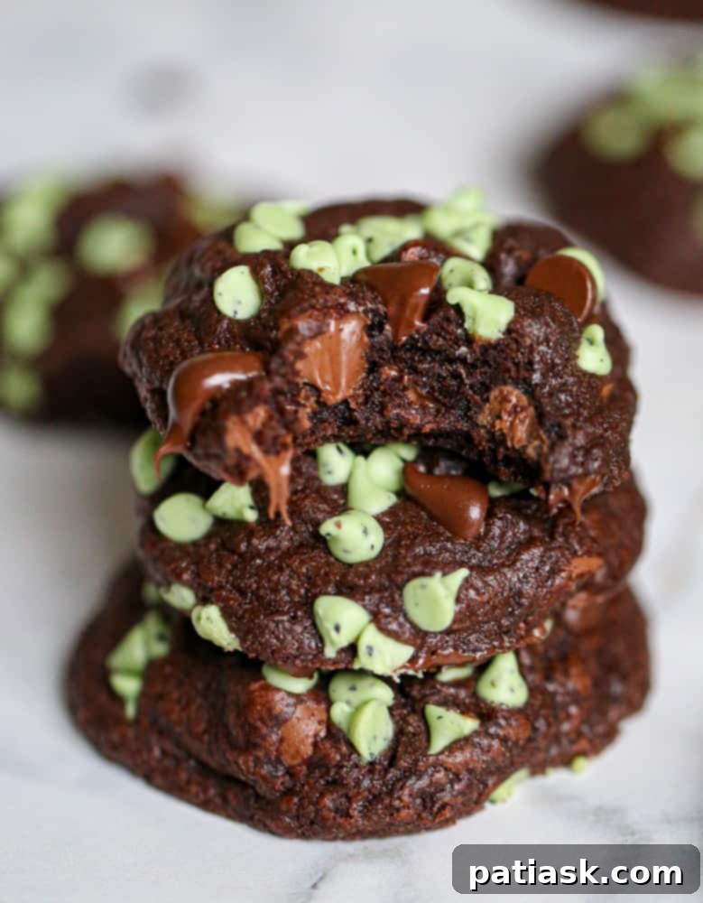 Irresistible Soft Batch Chocolate Mint Chip Cookies 3 Close-up of a stack of Soft Batch Chocolate Mint Chip Cookies, showing their fudgy texture and mint chips