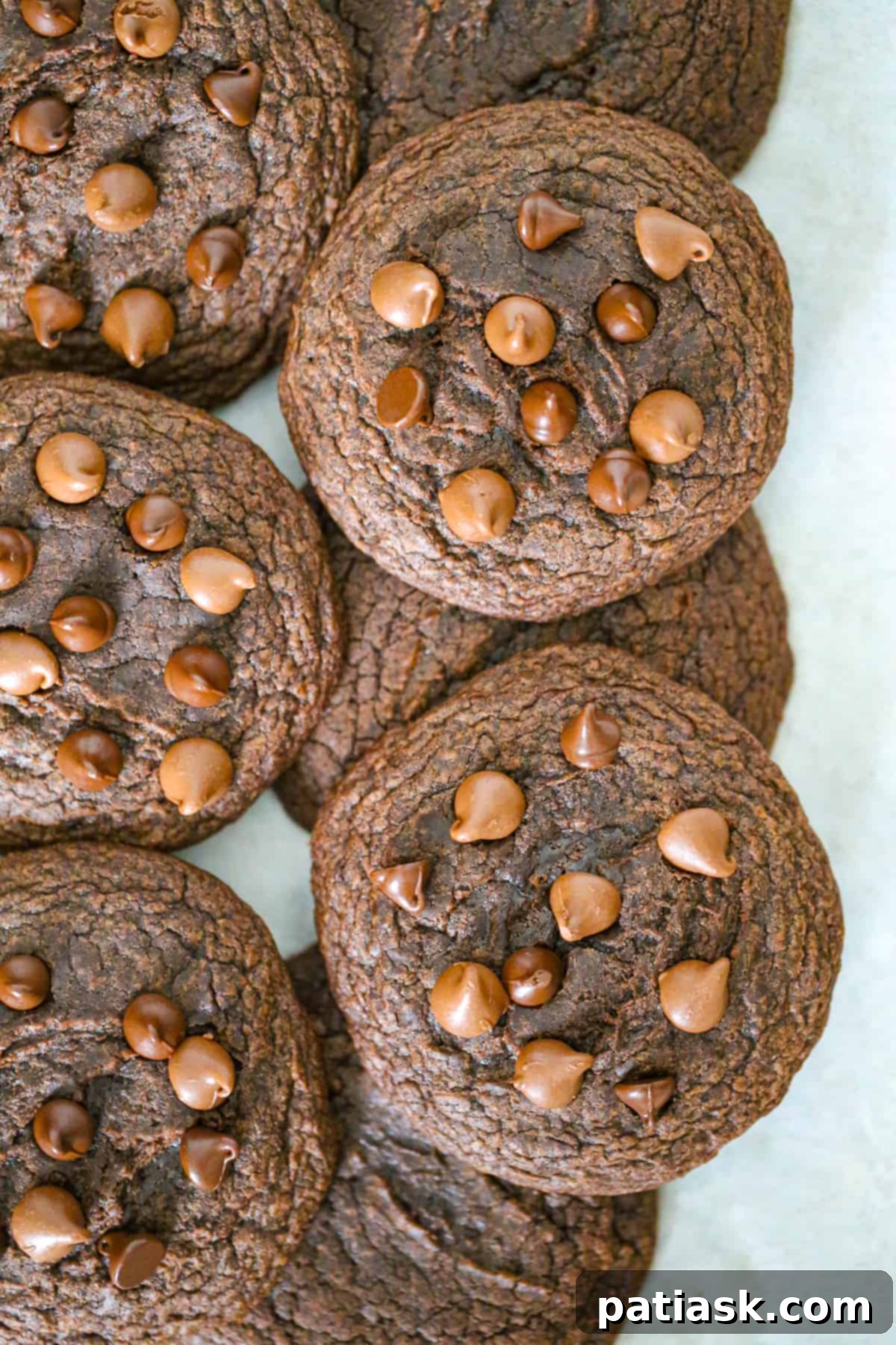 Effortless Brownie Cookies 2 Easy chocolate Brownie Mix Cookies cookie recipe brownies - a stack of fudgy, chewy brownie cookies on a cooling rack