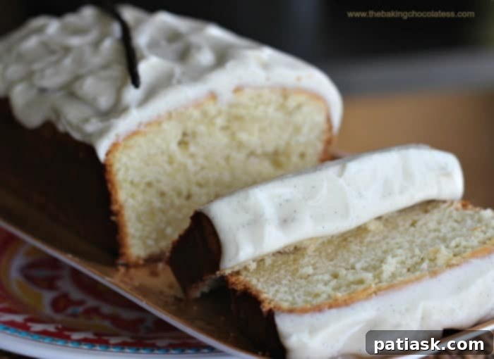 Golden Vanilla Pound Cake with Velvety Vanilla Bean Frosting 3 Closeup of Vanilla Bean Cream Cheese Pound Cake Loaf with Frosting, showing its moist texture.