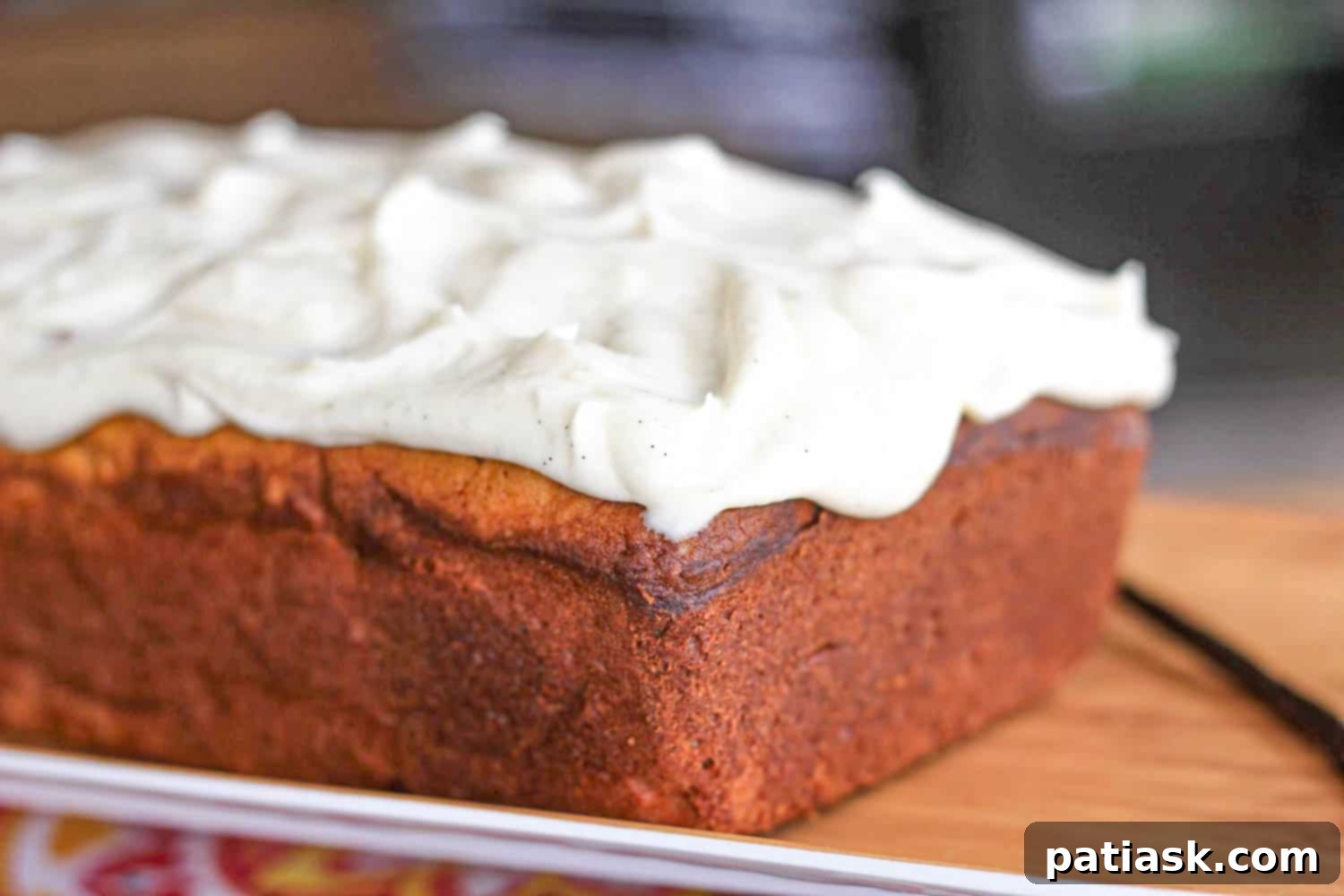 Golden Vanilla Pound Cake with Velvety Vanilla Bean Frosting 5 Full Vanilla Bean Pound Cake Loaf, freshly baked and ready for frosting.