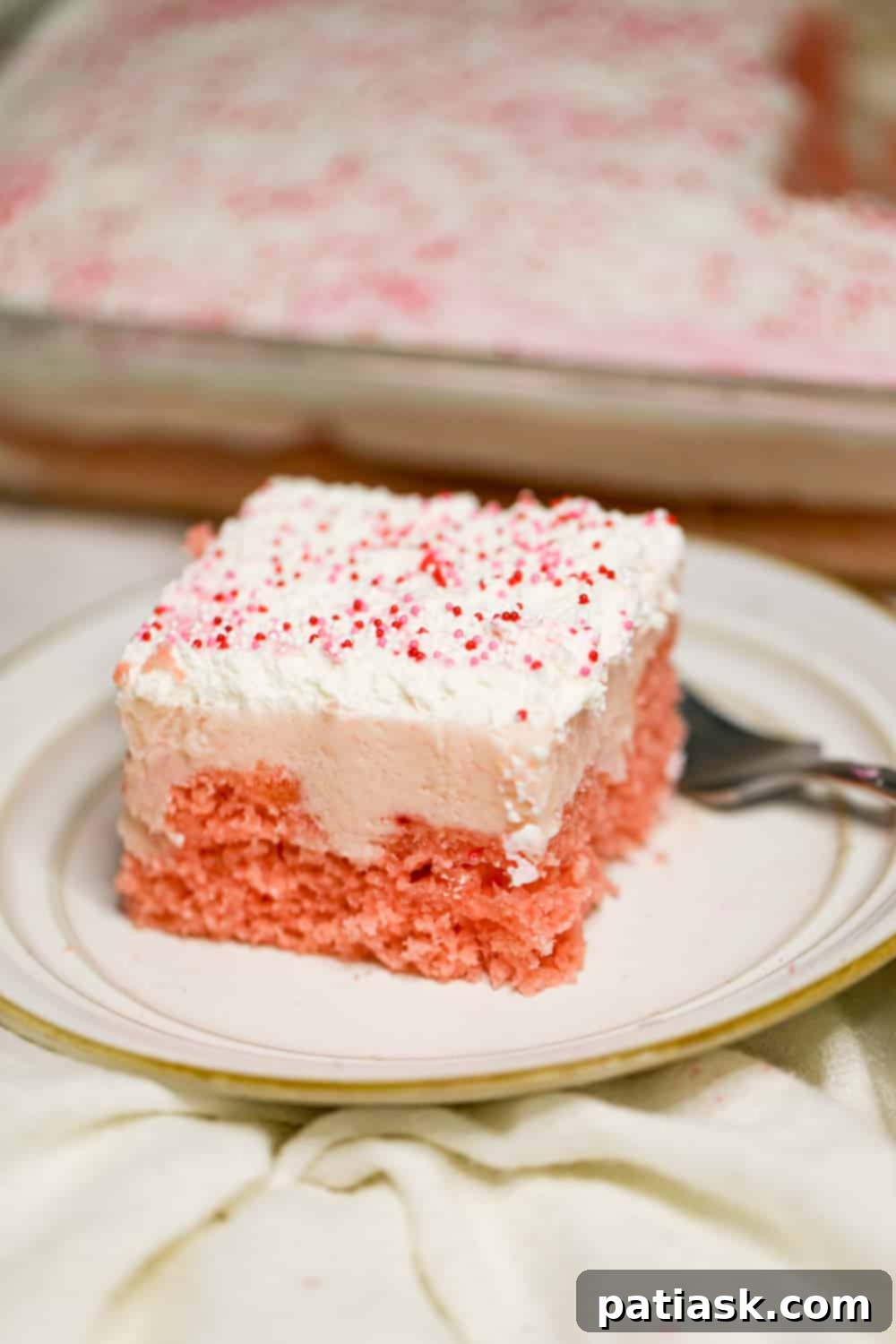 Strawberry Cream Passion Poke Cake 5 strawberry pudding poke cake