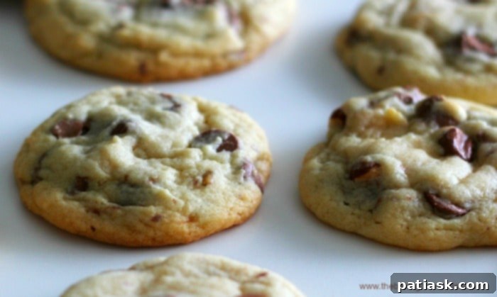 Symphony's Velvety Milk Chocolate Chip Cookies 3 Close-up of baked Symphony Almond Toffee Milk Chocolate Chip Cookies, showing melted chocolate and toffee
