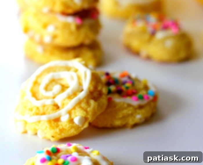 Zesty Lemon Cream Cheese Cookies 4 Lemon Cream Cheese and White Chocolate Chip Cookies on a cooling rack