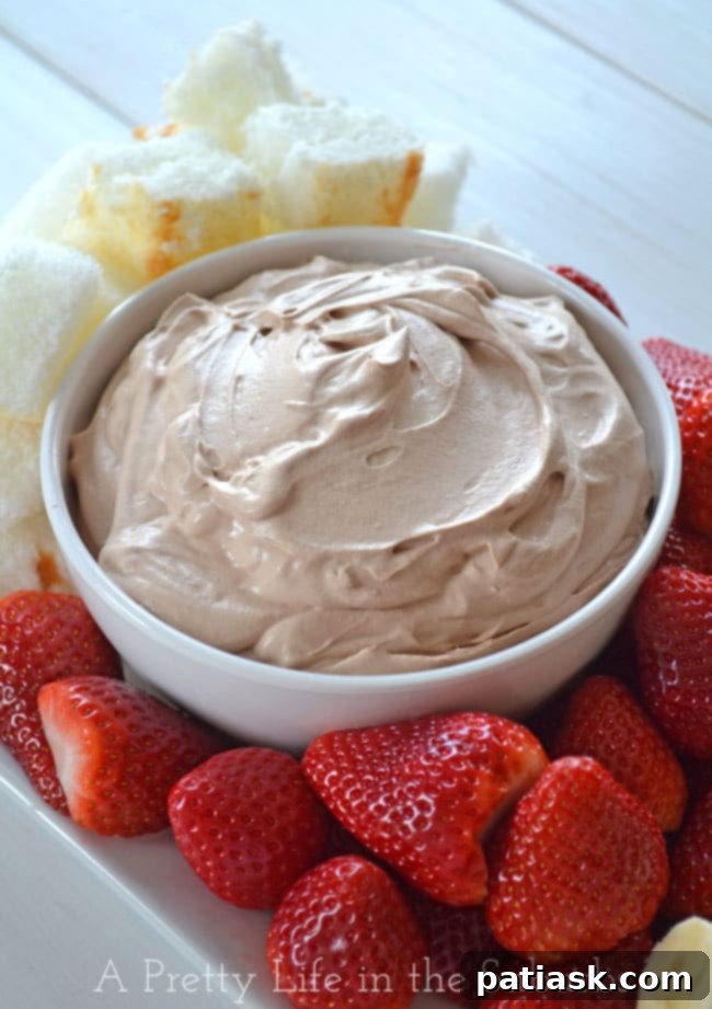 Chocolate-Marshmallow-Fluff-Dip-2A-Pretty-Life 3 Ingredient Chocolate Marshmallow Fluff Dip from A Pretty Life, an easy, light, and fluffy chocolate dessert perfect for dipping fruit and cake.