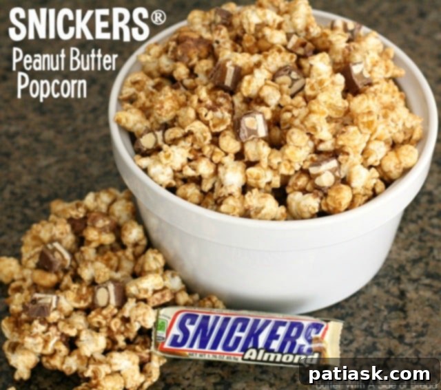 Sweet and salty Snickers Peanut Butter Popcorn, a perfect snack for any time of day.