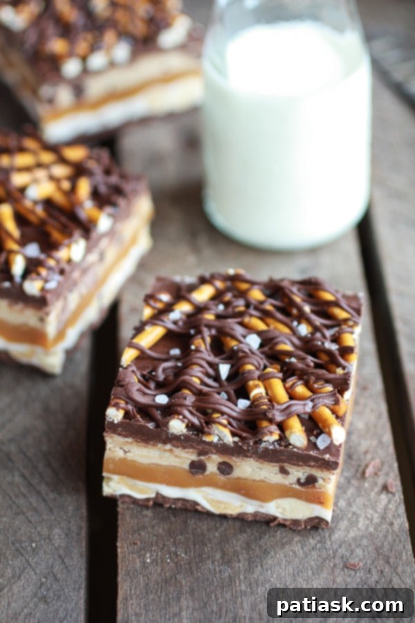 Salted Pretzel Chocolate Chip Cookie Dough Snickers Bars, an insane combination of flavors and textures.