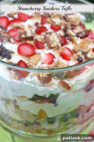 Beautiful and delicious Strawberry Snickers Trifle, an elegant Snickers dessert.