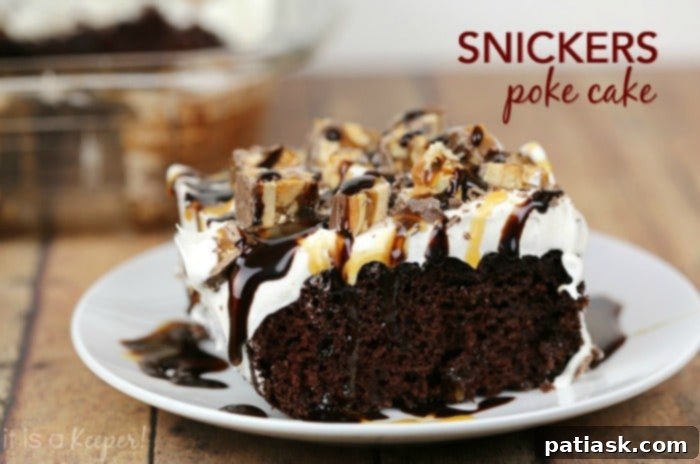 Delicious Snickers Poke Cake with chocolate, caramel, and peanuts, topped with amazing frosting.