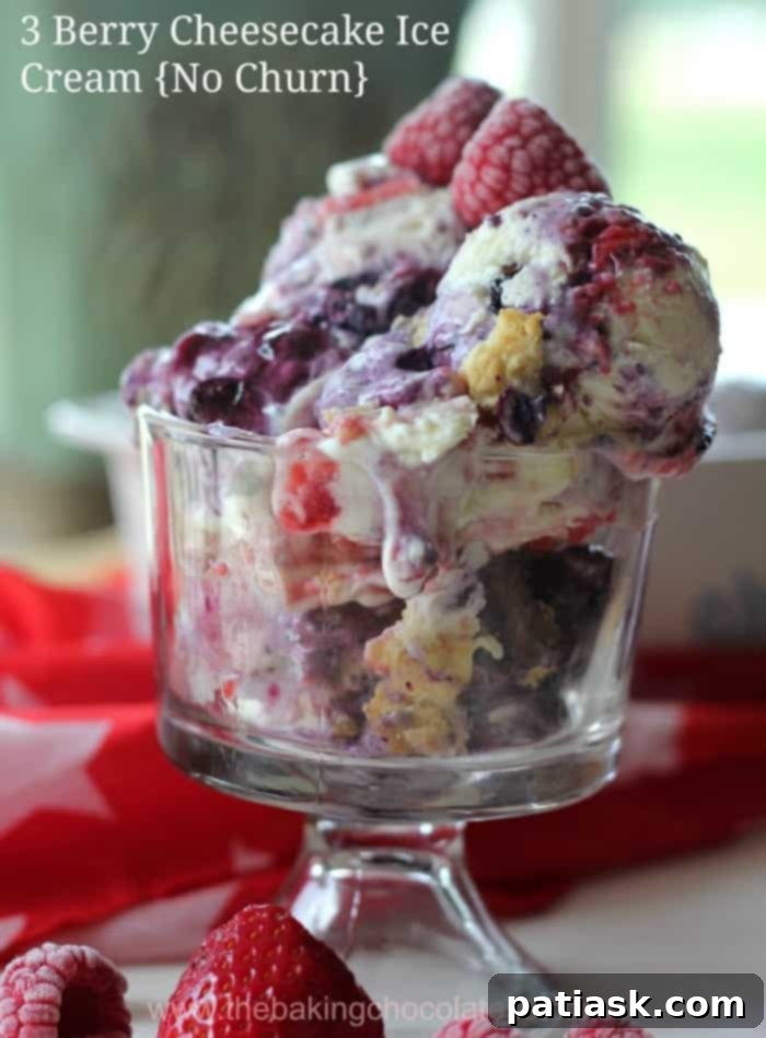 Triple Berry No-Churn Cheesecake Ice Cream 2 A vibrant, close-up image of the 3 Berry Cheesecake Ice Cream, showing rich creamy texture swirled with blueberries, raspberries, and strawberries. This no-churn dessert promises a delightful summer treat.