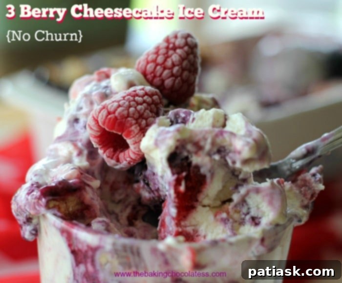 Triple Berry No-Churn Cheesecake Ice Cream 4 A beautifully scooped portion of No-Churn 3 Berry Cheesecake Ice Cream, garnished with fresh berries, highlighting its creamy texture and vibrant swirls.