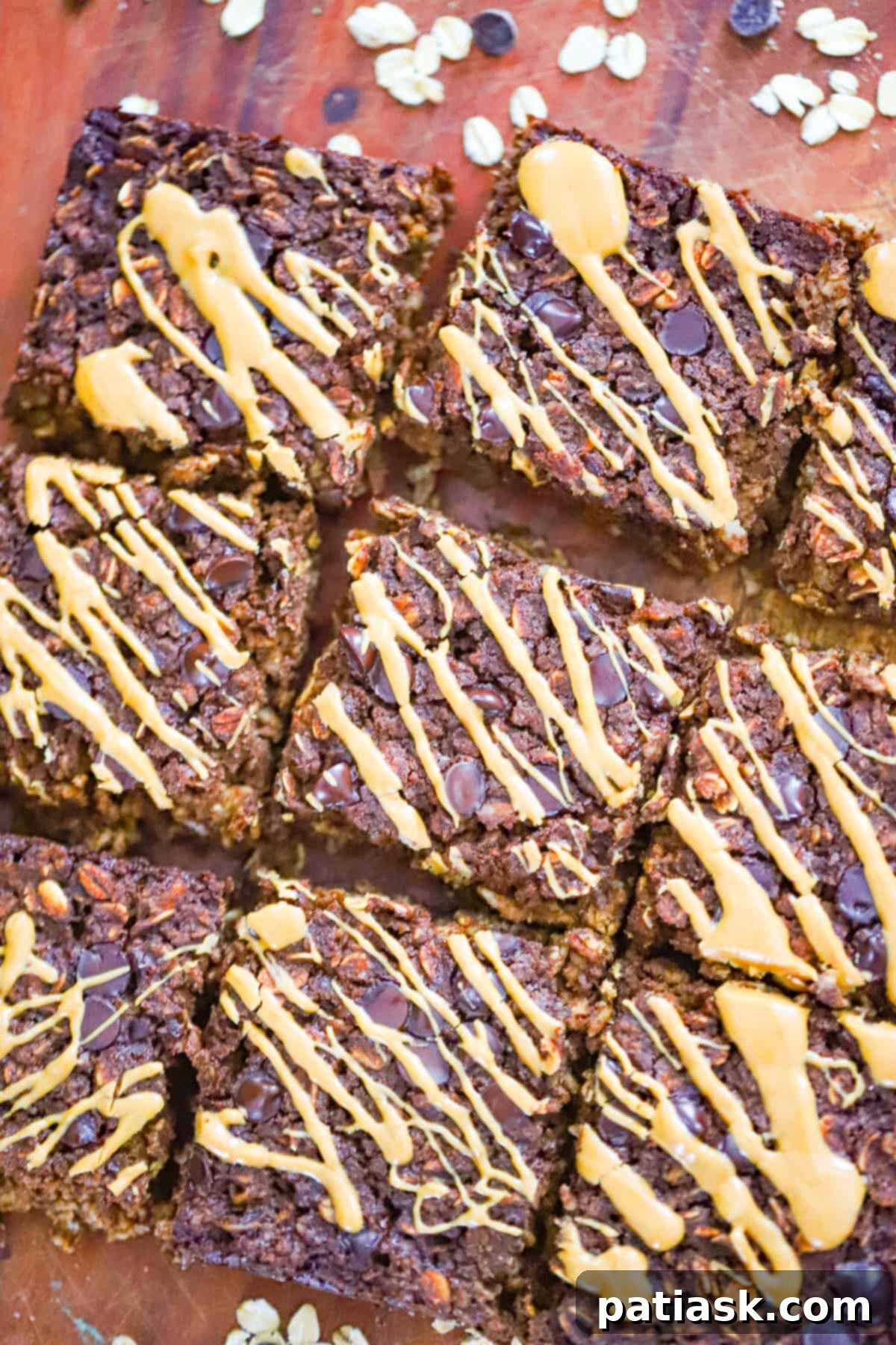 Healthy Chocolate Baked Oatmeal Brownie 2 Brownie baked oatmeal in a baking dish with melted chocolate chips on top